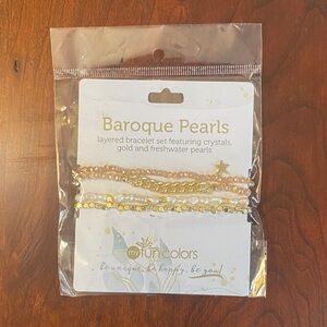 Layered bracelet set featuring crystals,gold and fresh water pearls. NWT